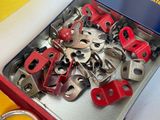 a metal box with a bunch of keys inside of it