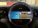 the dashboard of a car with a view of a parking lot