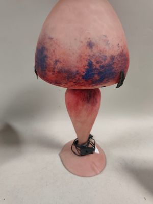 a pink vase with a purple and blue design on it