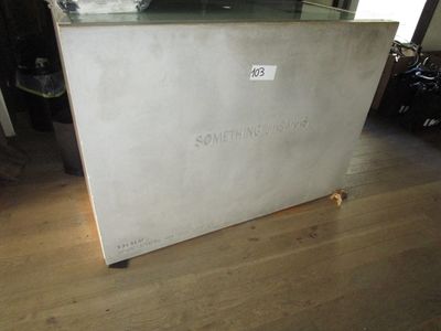 a white refrigerator sitting on a wooden floor in a room