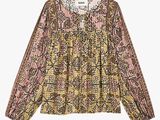 a women ' s blouse with a floral pattern and long sleeves