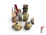 many different types of vases and containers on the table