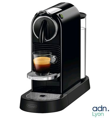 an image of a black coffee machine with a cup of coffee