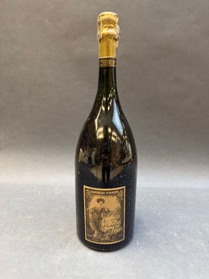 a bottle of wine sitting on top of a table next to a gray background