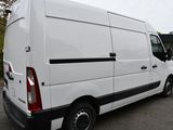 a white van that is parked in a parking lot