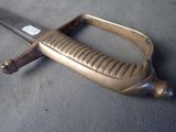 a very old sword that is laying on the floor