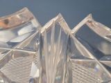 a clear glass vase with a silver lid