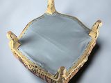 an image of a mirror sitting on top of a white table