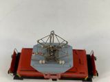 a red and blue toy train on a white surface