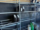 a rack with tires and other items in a garage