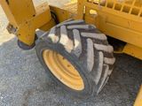 a large tire on the back of a construction vehicle