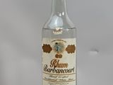 a bottle of rum sitting on top of a wooden stand