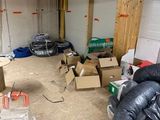 a room that has a lot of boxes and a chair in it