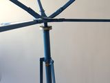 a blue umbrella that is hanging from the ceiling