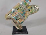 an image of a sculpture of a bird made out of newspaper