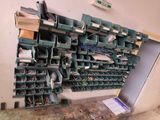 many green bins on the wall in the room