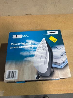 a box with a white and black iron on a table