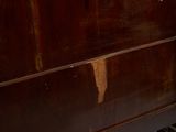 a wooden dresser with a mirror on top of it
