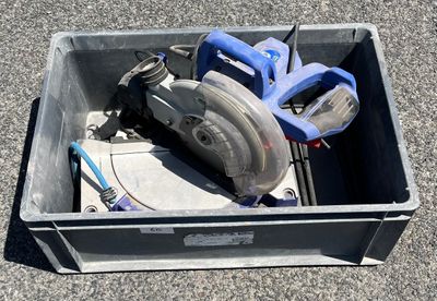 a box with tools in it sitting on the ground
