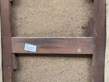 a picture of an old wooden frame with a sticker on it