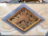 a clock that is sitting on top of a table