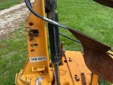 a yellow machine that is sitting in the grass