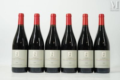 six bottles of red wine lined up in a row