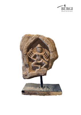 an image of a stone sculpture of a person sitting on a rock