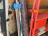 a red bench in the back of a moving truck
