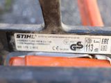 a close up of a bike chain with a tag on it