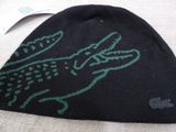 a black hat with a green alligator on it