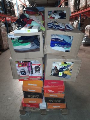 many boxes of shoes stacked on top of each other in a warehouse