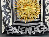 an image of a large black and white flag with a sun