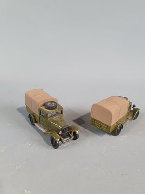 two toy cars that are sitting next to each other