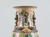 a vase that has a lot of different designs on it