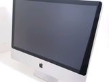 a computer monitor sitting on top of a white desk