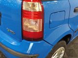 a blue car that is parked in a garage