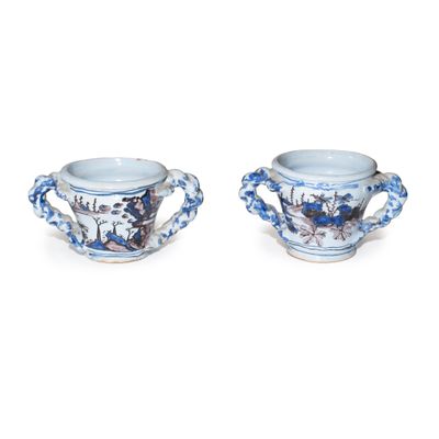 pair of blue and white vases with handles and handles