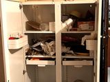 a refrigerator that has a lot of dishes inside of it