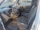 a car that is sitting in a parking lot with its door open