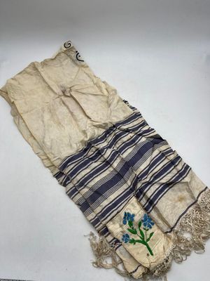a close up of a piece of cloth with a flower on it