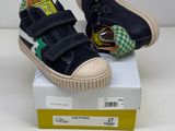 boys ' s black and green sneakers with green and white checkers on them