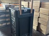 a black box with a handle on top of a table