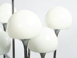 a chandelier made of glass balls on a metal stand
