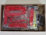a box with a toy train set inside of it