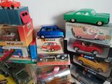 a lot of toy cars that are stacked on top of each other