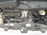 a picture of a car engine with its hood open