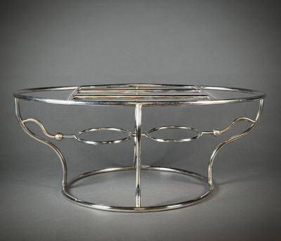 Chauffe-plat à double foyer en métal argenté.