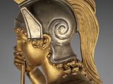 an image of a statue of a roman soldier with a sword