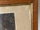 framed picture of a woman in a dress with a flower in her hair